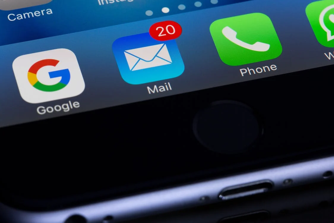 A phone screen with email icon and other widgets
