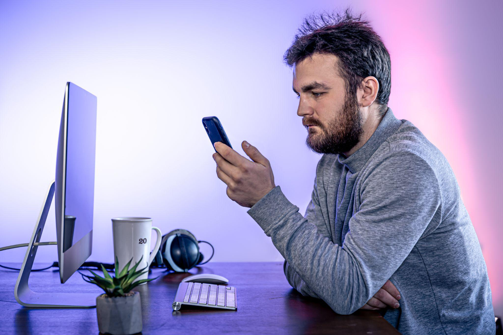 A man sitting in front of his home computer
