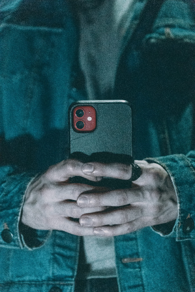 A man holding a phone in his hands