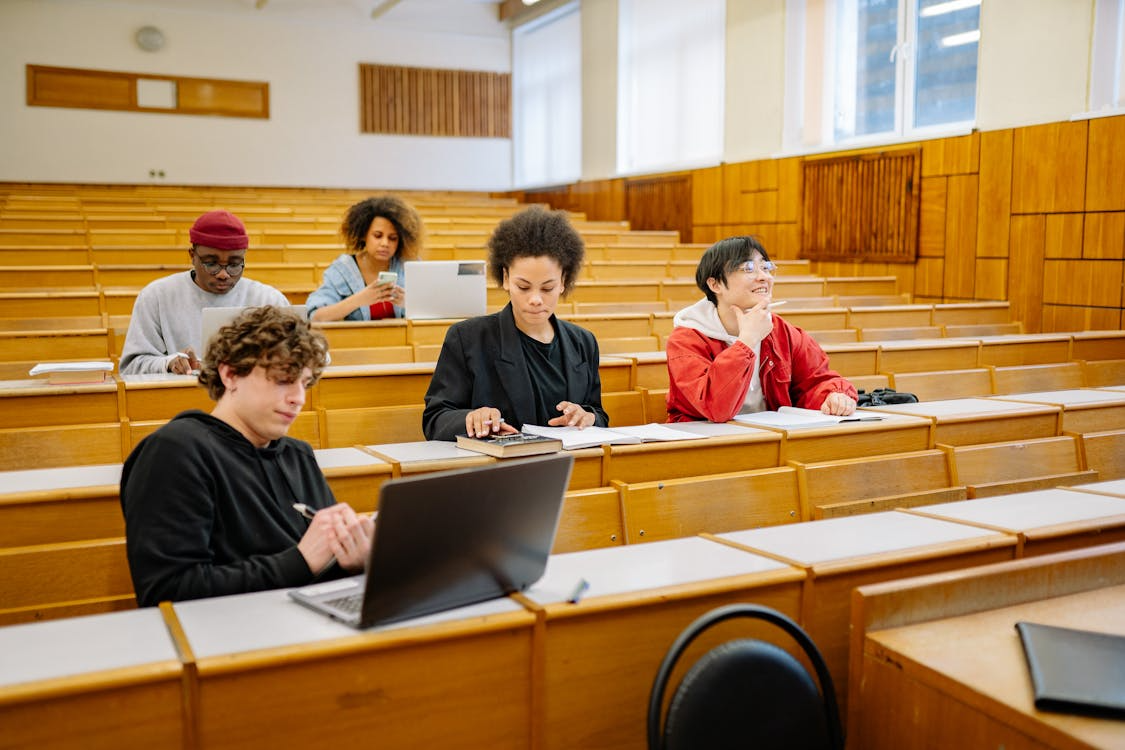 Students using laptops in a classroom